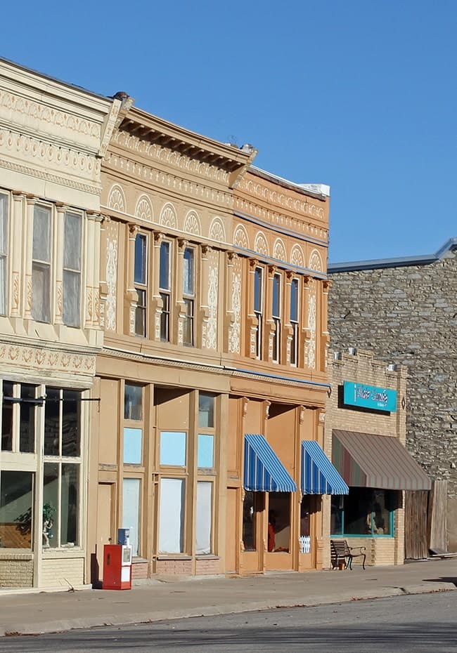 Community gathering in Newkirk, Oklahoma, showing Land Run Distillery's involvement in local events and economic development